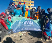 Climber summitting Mt. Kilimanjaro
