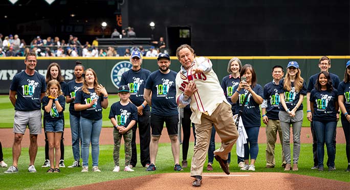 Joe Hutchinson throws a ceremonial first pitch at a Mariners game